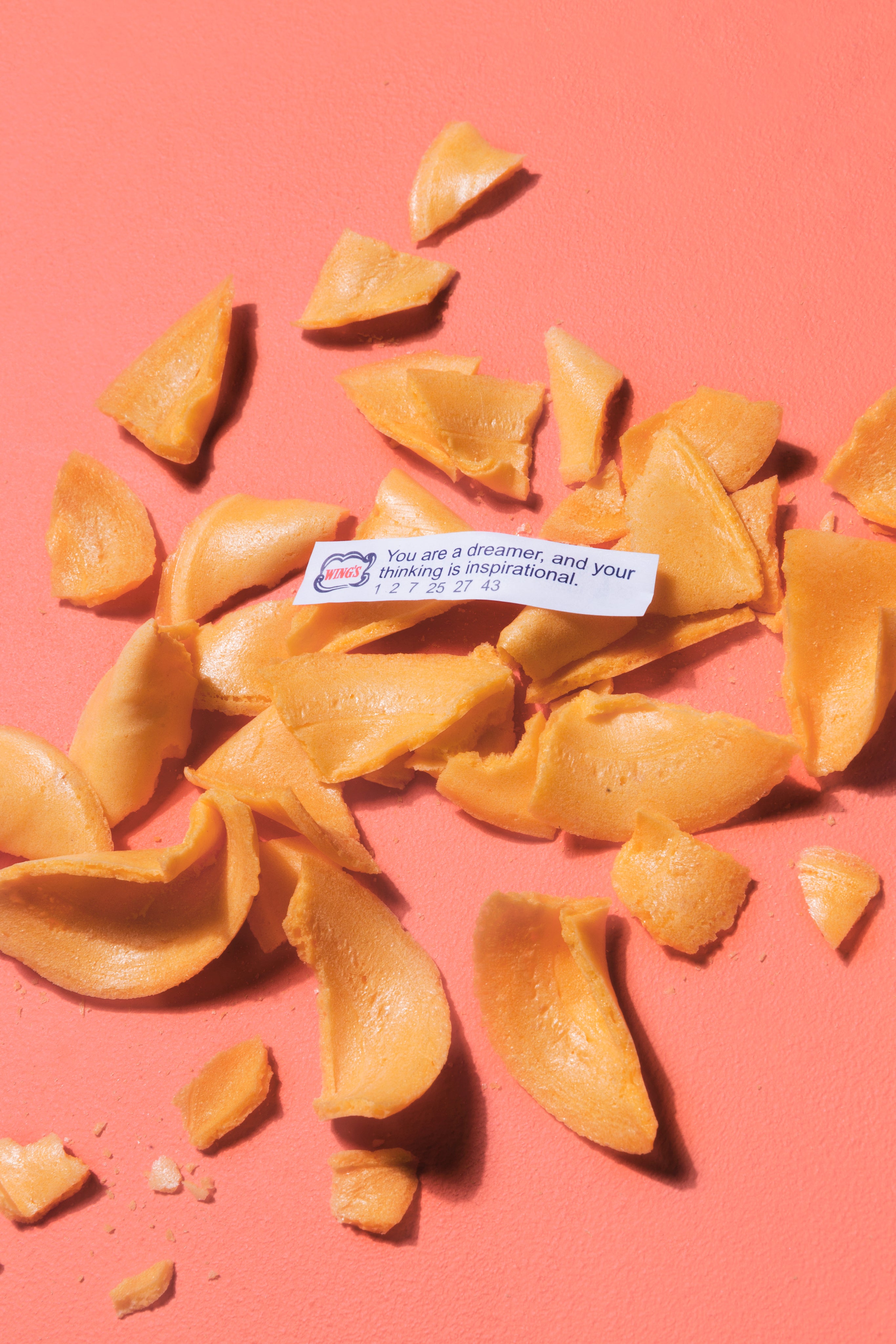 Cracked fortune cookie with visible fortune