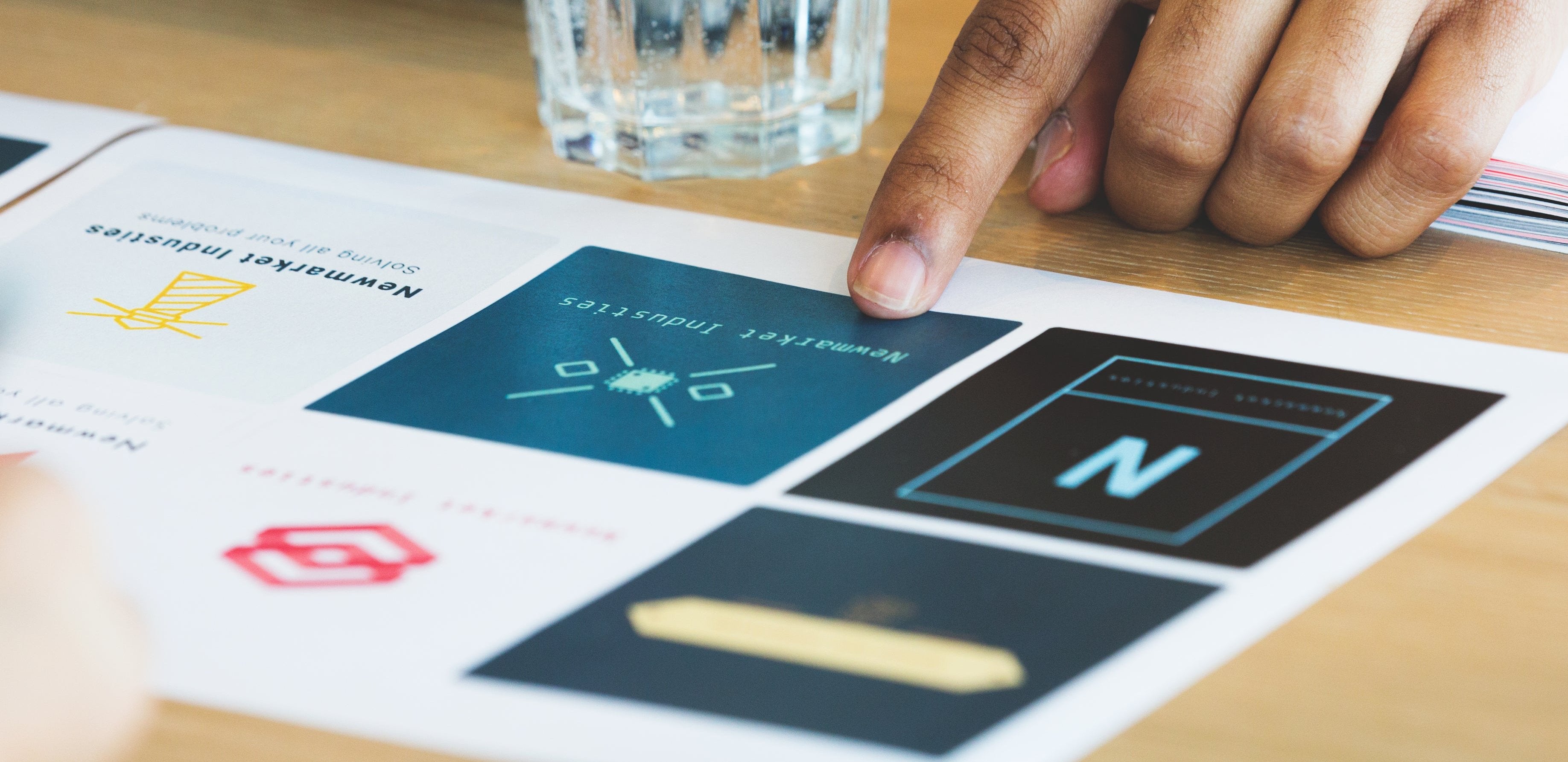 Finger pointing at logo design options